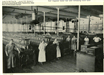 Newspaper Clipping of Women Standing in a Factory
