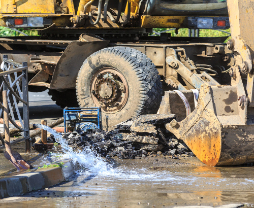 broken pipe and excavator