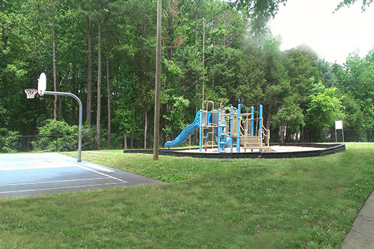 Playground Equipment and a Basketball Court