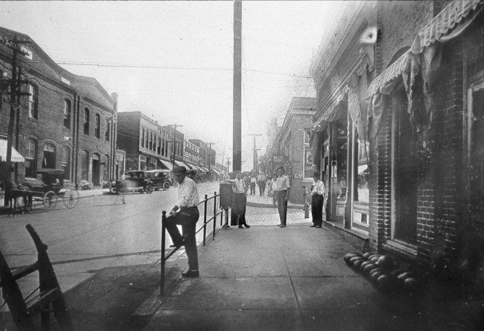 People Standing on a Sidewalk