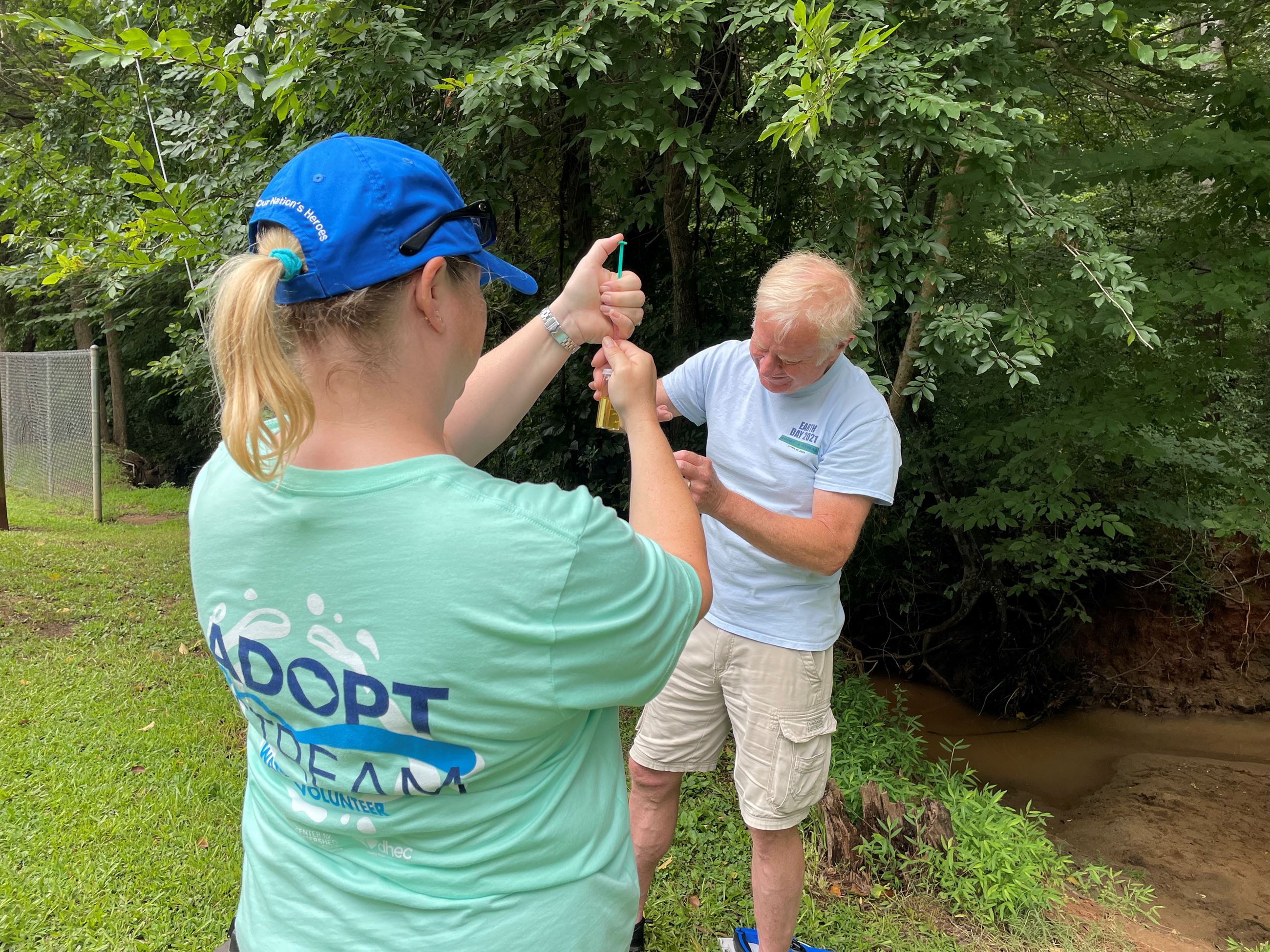 Two people near creek