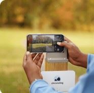 Picture of a smart phone being placed in the photo bracket